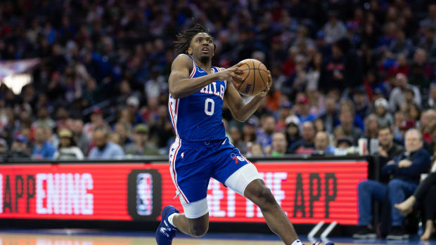 Philadelphia 76ers guard Tyrese Maxey dribbles to the rim.